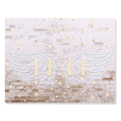 11:11 ColourPop Shadow Palette closed, featuring gold 11:11 centered between white angel wings on a faded white brick backdrop with scattered gold stars and dots, ColourPop logo above - front cover of the eyeshadow palette.
