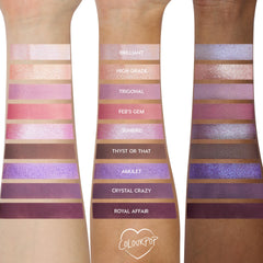 Arm swatches show the All Amethyst ColourPop Shadow Palette on three skin tones, displaying nine lilac, pink, and deep plum shades in matte and shimmer - e.g., Brilliant, Feb’s Gem, Royal Affair - with labeled stripes for color payoff comparison.