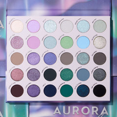 Top-down view of the Aurora Struck palette: 30 shades from icy pearl and lilac to teal, navy and black