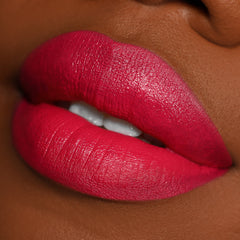 Close-up lips wearing I Heart This ColourPop Lippie Pencil, lining and filling the mouth in a vibrant fuchsia-red with smooth, creamy coverage and crisp edges, showcased in a studio beauty shot to highlight pigment and precision.