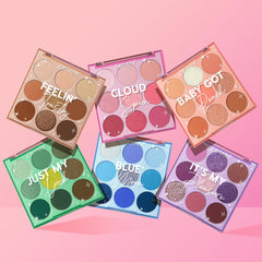 Rainbow Rush ColourPop Shadow Palette Set showcasing six open 9-pan palettes - Cloud Spun, Baby Got Peach, Just My Luck, Blue Moon, It’s My Pleasure, and Feelin’ Toasty - fanned on a pink gradient background with matte and shimmer monochrome shades.