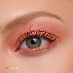 Close-up of a fair-skin eye wearing Flareon tangerine shadow stick