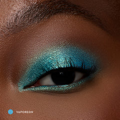 Close-up of a deep-skin eye wearing Vaporeon bright aqua shadow stick