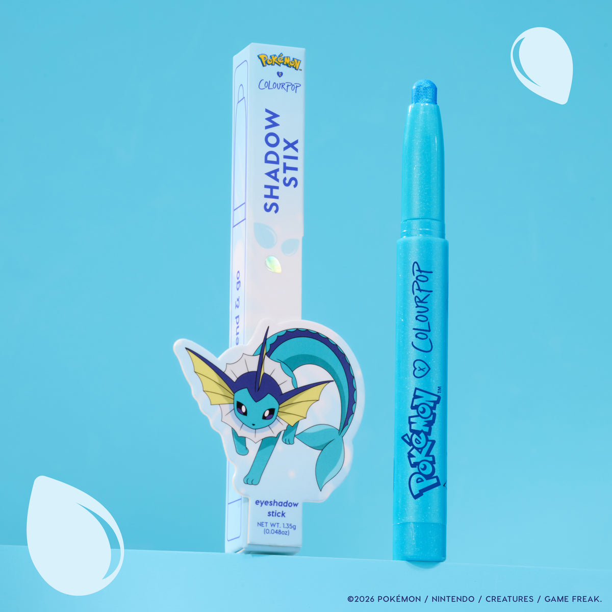Vaporeon Multichrome Shadow Stix, an aqua stick, next to its Vaporeon box on a blue backdrop