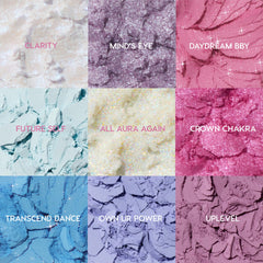 Colourpop In A Trance shadow palette macro showing nine crushed pastel and glitter pans labeled Clarity, Mindβs Eye, Daydream BBY, Future Self, All Aura Again, Crown Chakra, Transcend Dance, Own Ur Power, and Uplevel in dreamy cool tones for US makeup lovers searching Shadow Palettes.