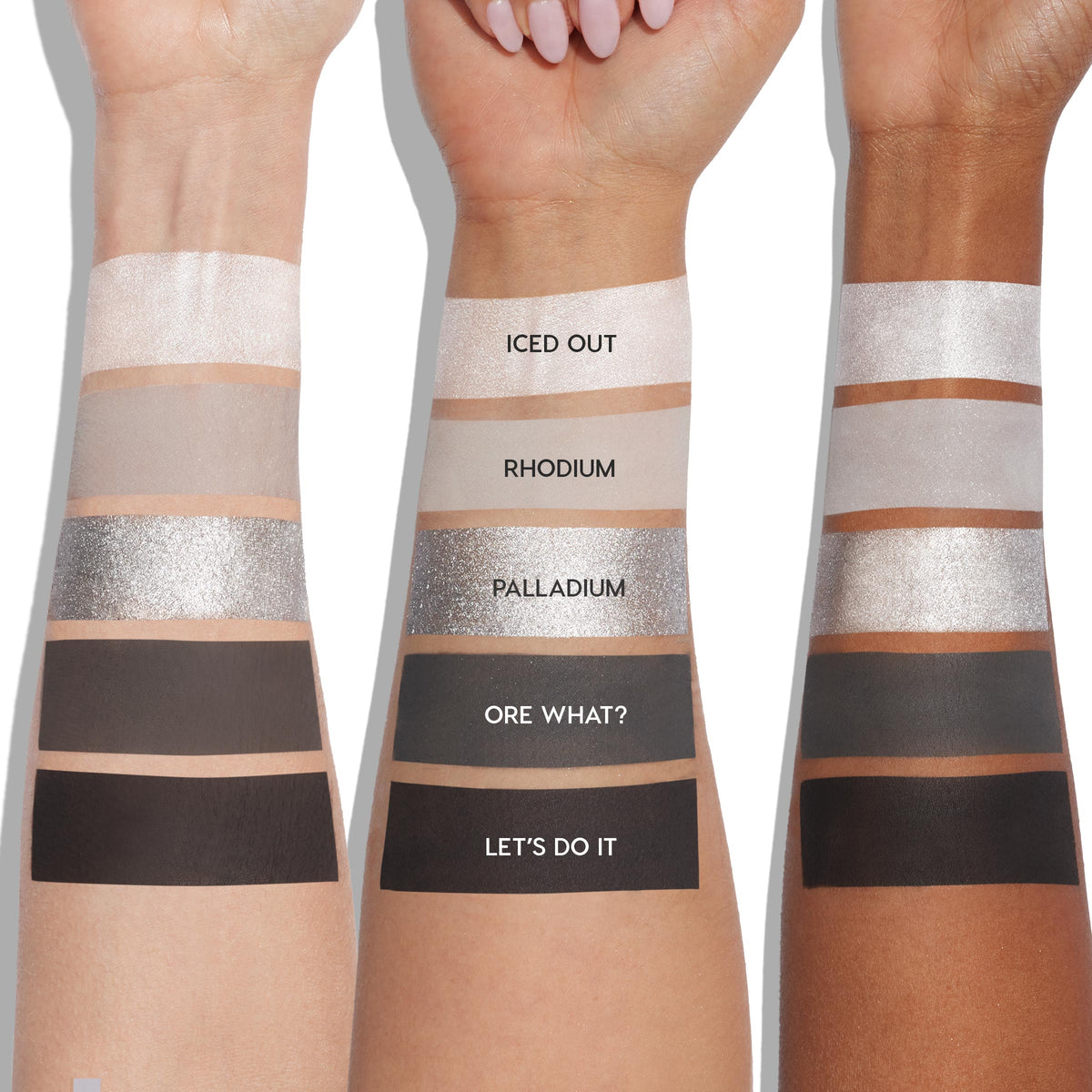 ColourPop Shadow Palette Precious Metals swatched on three arms from light to deep skin tones, showing five shades: Iced Out (pearl shimmer), Rhodium (matte taupe), Palladium (sparkling silver), Ore What? (matte charcoal), Let's Do It (matte black).