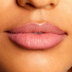 Soft mauve-pink lips lined and filled with the Good N Plenty shade, highlighting the creamy, satin finish and crisp edges of the ColourPop Lippie Pencil in a tight close-up of the mouth against natural skin.