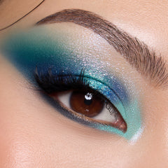 Close-up of a light-skin eye with deep teal, blue and aqua shadow from the Under the Sea palette