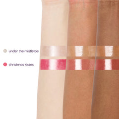 Under the Mistletoe and Christmas Kisses Ultra Glossy Lip arm swatches on three skin tones