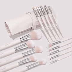 Metallic Mood ColourPop Shadow Palette & Brush Set displayed with a blush-pink brush roll; soft pink handles with silver ferrules and fluffy face plus precision eye brushes labeled E1–E8 are fanned on a light background, logo embossed on the roll.