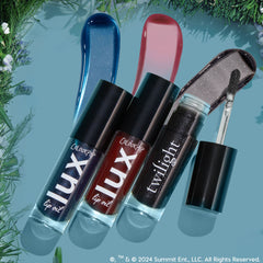 Vampy Lips ColourPop Lux Lip Oil trio in blue shimmer, deep red, and black sparkle shades, shown with glossy swatches and an open doe-foot applicator, bottles angled on a teal backdrop bordered by greenery.