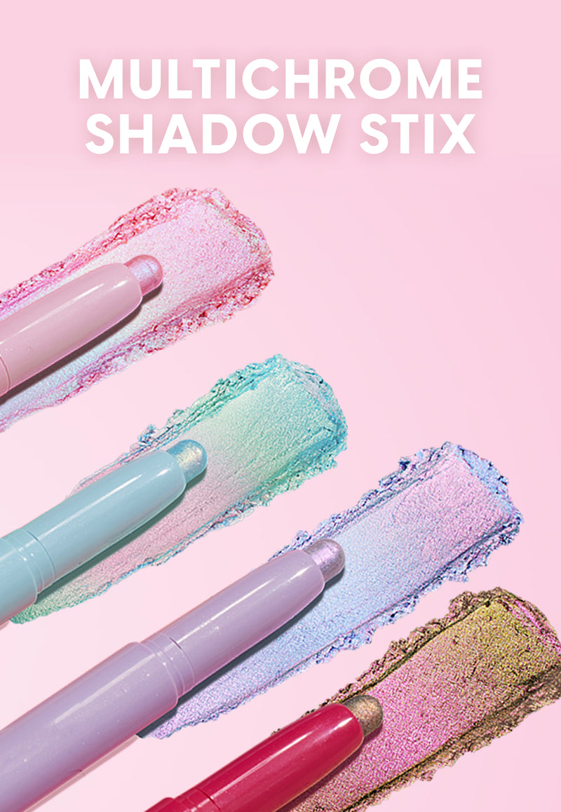 Four pastel multichrome Shadow Stix cream eyeshadow pencils swipe iridescent pink, mint, lavender, and gold shades across a soft pink background, showcasing shimmery color payoff and blendable stick formula for easy eye makeup looks.