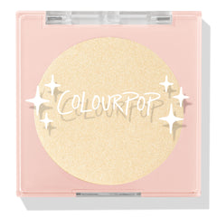 Minted pressed powder highlighter compact showcasing a shimmering champagne-gold pan, closed in a blush-pink square case with clear lid and ColourPop logo and star accents on a white background; ColourPop Pressed Powder Highlighter.