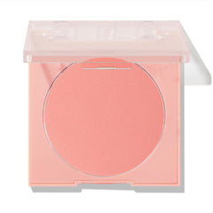 Swirled ColourPop Pressed Powder Blush shown half-open, a soft peachy‑pink pan in a pale pink square compact with a translucent lid, photographed on a white background for product display.