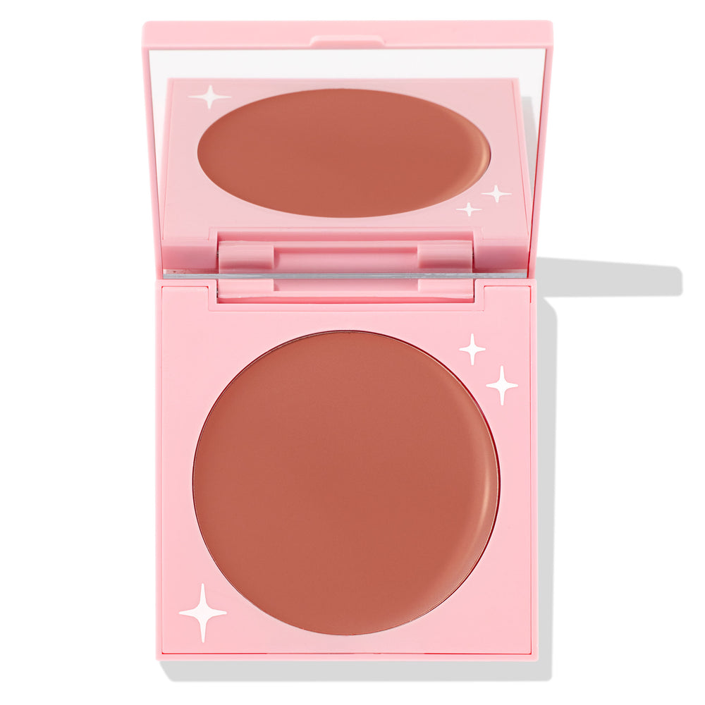 Bali Baby ColourPop Cream Blush opens to reveal a matte rosy-nude pan in a light pink compact with white star accents and a built-in mirror, studio-lit on a white background.