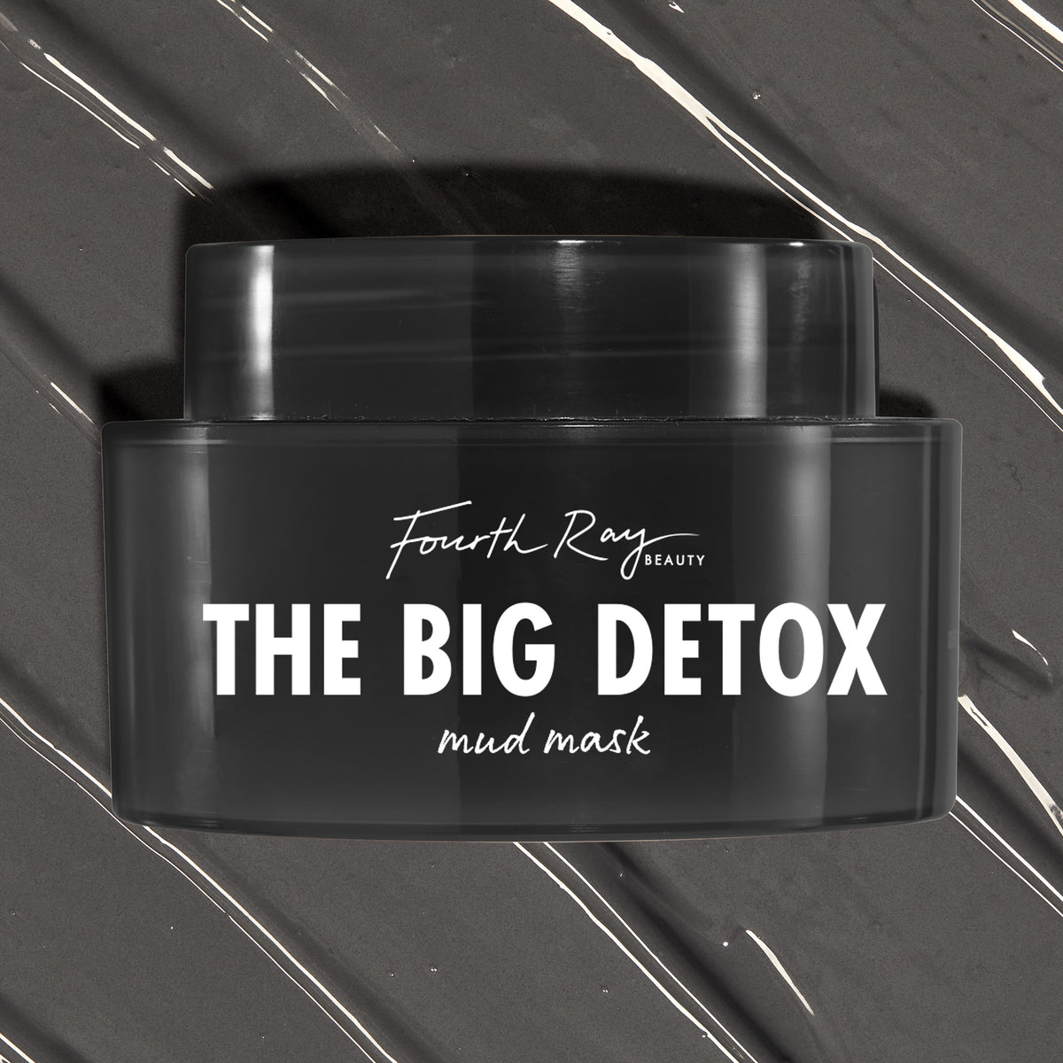 Black Fourth Ray Beauty The Big Detox Mud Mask jar displayed in a close-up flat lay, the ColourPop Face Mask resting on swirled charcoal mud with white streaks, showcasing the sleek container and bold white logo for detoxifying skincare.