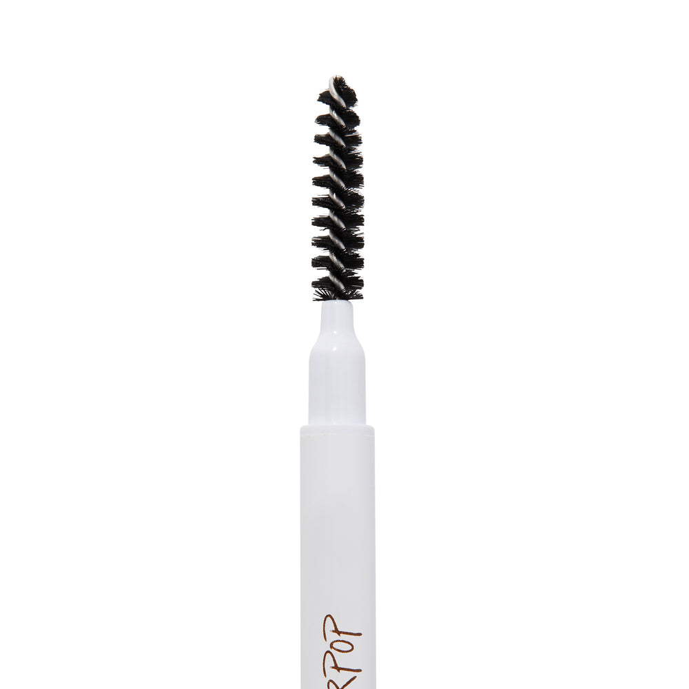 Spoolie-tipped ColourPop Dope Taupe Brow Pencil standing upright, showcasing a white tube and dense black spiral bristles against a plain white background.