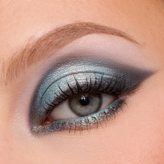 Close-up of a fair-skin eye wearing a smoky icy blue and silver wing from the Eeveelution palette