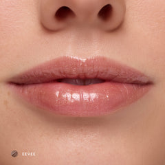 Close-up of fair-tone lips wearing Eevee sheer nude glossy lip balm
