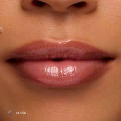 Close-up of medium-tone lips wearing Eevee sheer nude glossy lip balm
