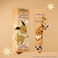 Eevee Fresh Kiss Glossy Lip Balm in Coconut Cream scent, tan tube with Eevee keychain charm next to its box