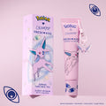 Espeon Fresh Kiss Glossy Lip Balm in Taro Milk Tea scent, lilac tube with Espeon keychain charm next to its box