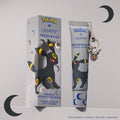 Umbreon Fresh Kiss Glossy Lip Balm in Brown Sugar Boba scent, grey tube with Umbreon keychain charm next to its box