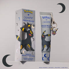 Umbreon Fresh Kiss Glossy Lip Balm in Brown Sugar Boba scent, grey tube with Umbreon keychain charm next to its box