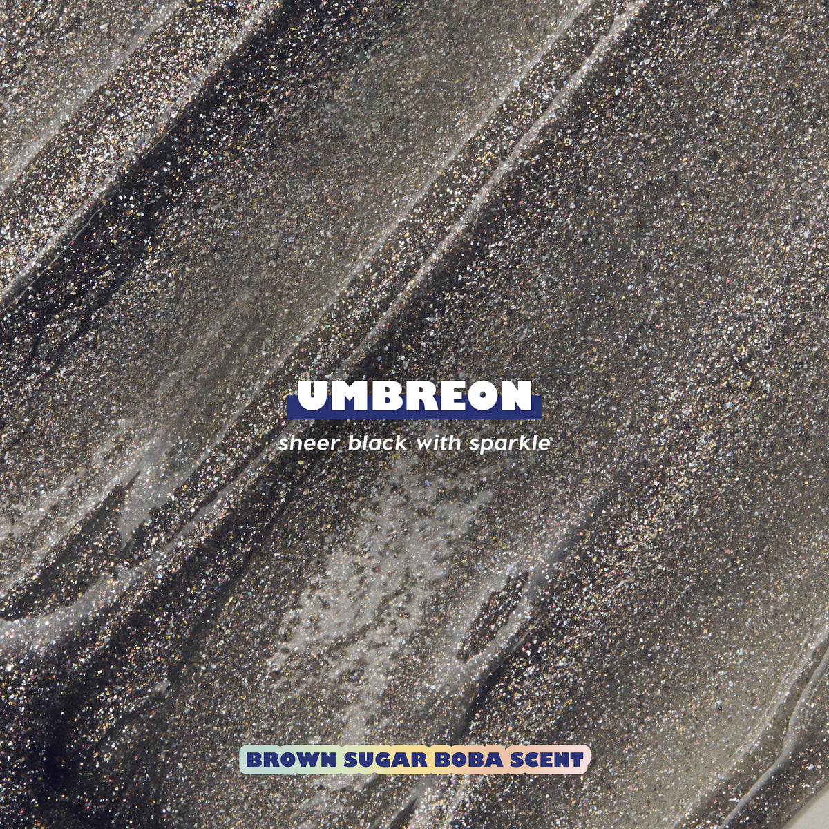 Umbreon Fresh Kiss Glossy Lip Balm texture swatch: sheer black with sparkle, Brown Sugar Boba scent