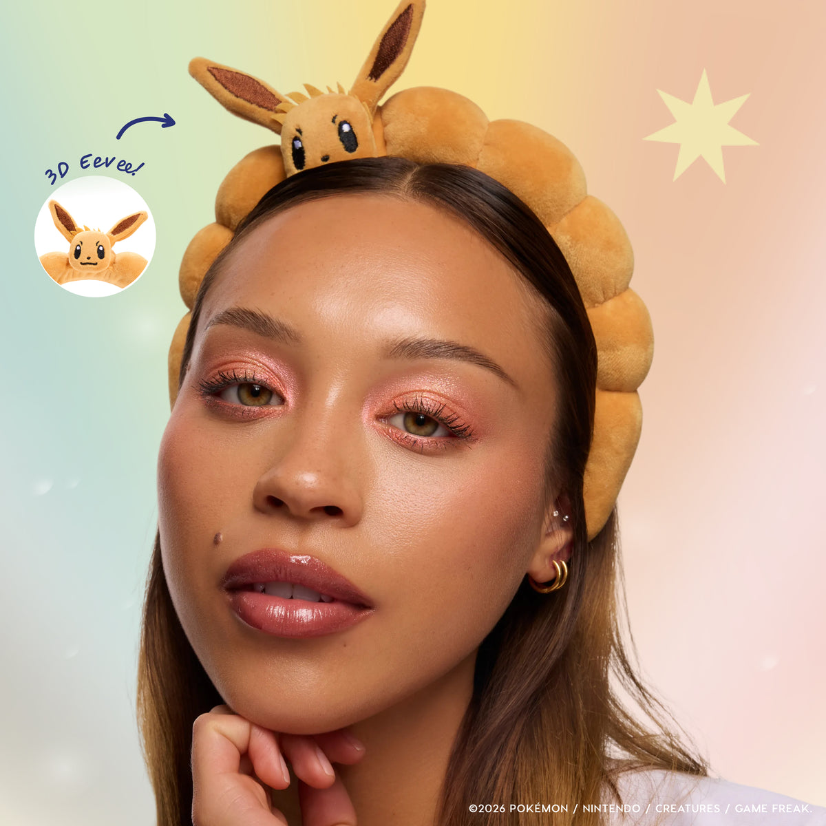 Model wearing the plush 3D Eevee Headband with soft peach eye makeup