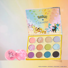 Touch of Sparkle set: Eeveelution Eyeshadow Palette open with a jar of Sylveon Glitterally Obsessed glitter