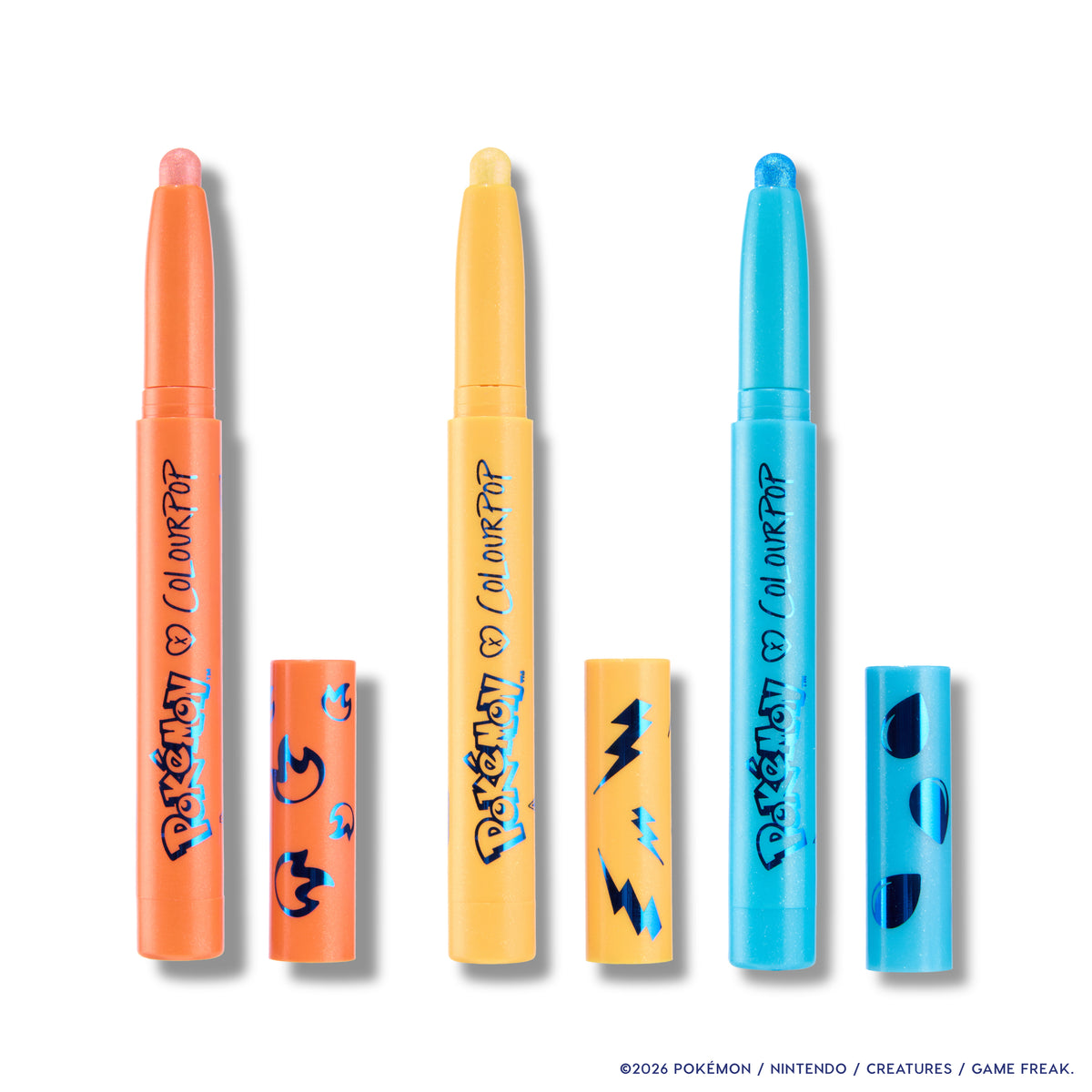 Flareon, Jolteon and Vaporeon Multichrome Shadow Stix uncapped, tangerine, gold and aqua, on white