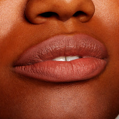 Matte-lined lips wear BFF2, a warm midtone nude brown, precisely outlining and softly filling the lips; ColourPop Lippie Pencil delivers smooth, even coverage in a tight beauty close-up.