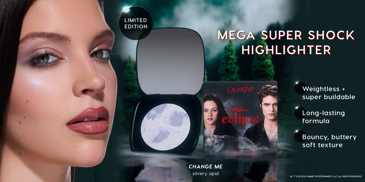 ColourPop Mega Super Shock Highlighter in Twilight Eclipse themed compact shown on a model’s cheek, with open silvery opal pan and product box against a misty forest backdrop, highlighting weightless, long‑lasting, bouncy soft formula benefits.