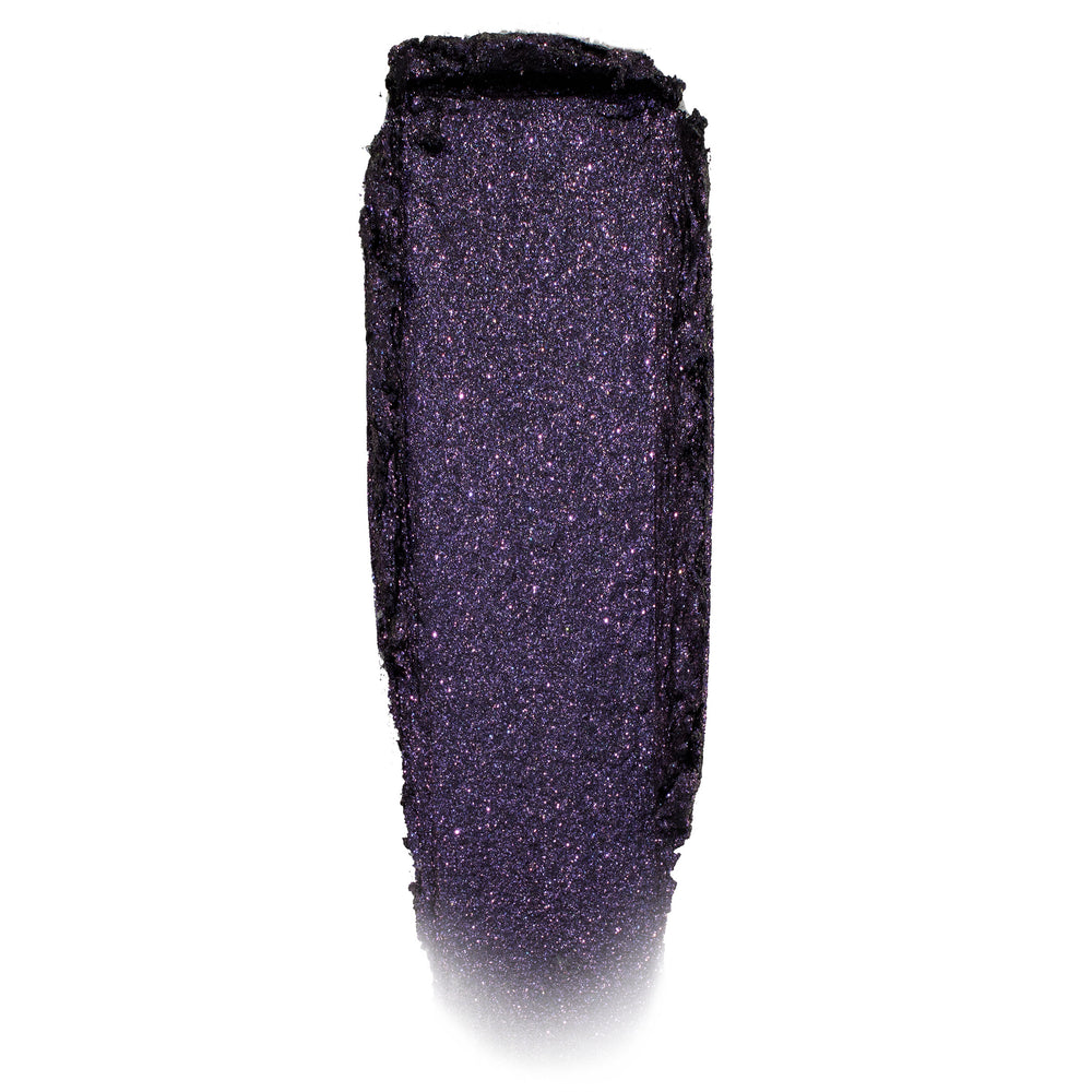 Deep violet-black, glittery eyeshadow swatch shimmering in a single swipe on a white background; Emo Inside Jelly Much Shadow by ColourPop, highlighting fine purple sparkle and the long-wear jelly texture of ColourPop Jelly Much Shadow.