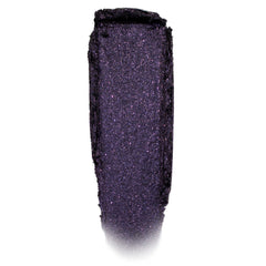 Deep violet-black, glittery eyeshadow swatch shimmering in a single swipe on a white background; Emo Inside Jelly Much Shadow by ColourPop, highlighting fine purple sparkle and the long-wear jelly texture of ColourPop Jelly Much Shadow.