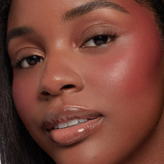 Neutral nude shimmer and matte shades from the Nude Mood ColourPop Shadow Palette blended on the eyelids, captured in a close-up with rosy cheeks and glossy lips, showcasing soft everyday tones and a smooth, luminous finish.