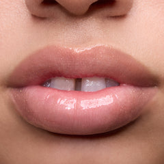 Close-up swatches of Colourpop Peach Mochi Fresh Kiss Glossy Balm on models’ lips, showing sheer peachy shimmer and high-shine finish, highlighting how this Lip Gloss & Lip Oil hybrid looks on different skin tones.