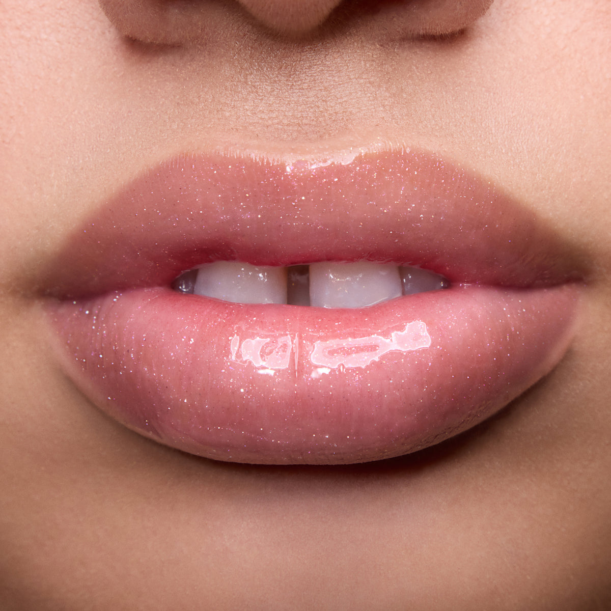 Close-up of models’ lips wearing Colourpop Fresh Kiss Glossy Balm in Raspberry Crème, showing sheer pink shimmer Lip Gloss & Lip Oil finish on different skin tones against a simple studio background.