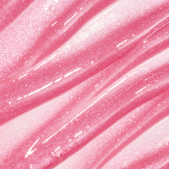 ColourPop Fresh Kiss Glossy Balm swatch in Raspberry Crème, showing sheer pink Lip Gloss & Lip Oil texture with shimmering pink and silver sparkles in smooth diagonal streaks against a glossy background.