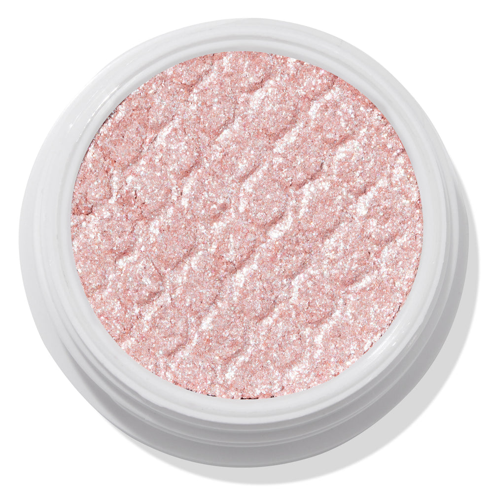 ColourPop Frog Super Shock Shadow shimmering in a white round pot, a pale pink‑champagne cream‑to‑powder eyeshadow with silver sparkle and a bouncy, textured finish, shown close up on a clean studio background.