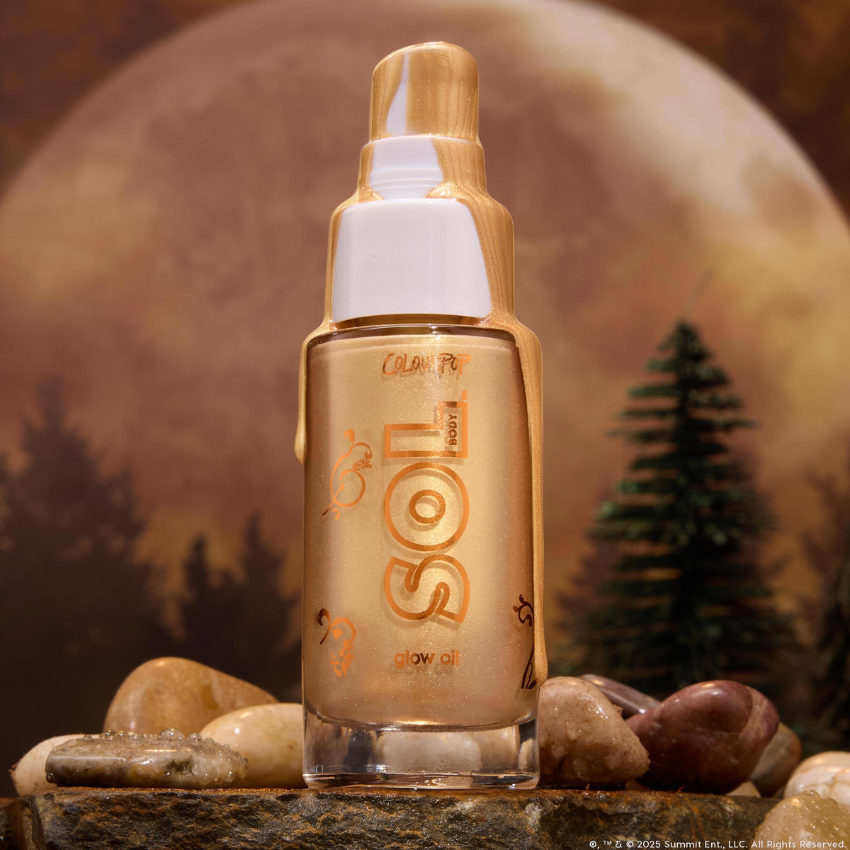 ColourPop SOL Glow Oil  -  It’s a Wolf Thing  -  standing upright with molten gold drips over a white pump, warm-bronze shimmer glowing through the glass bottle, set on dewy rocks by pine trees under a full moon, evoking a moody forest vibe.