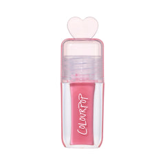 ColourPop Still That Girl ultra glossy lip in pink, standing upright with a clear rectangular tube, heart-shaped cap, and Heart to Get inspired packaging on a clean white background for a modern makeup product shot.