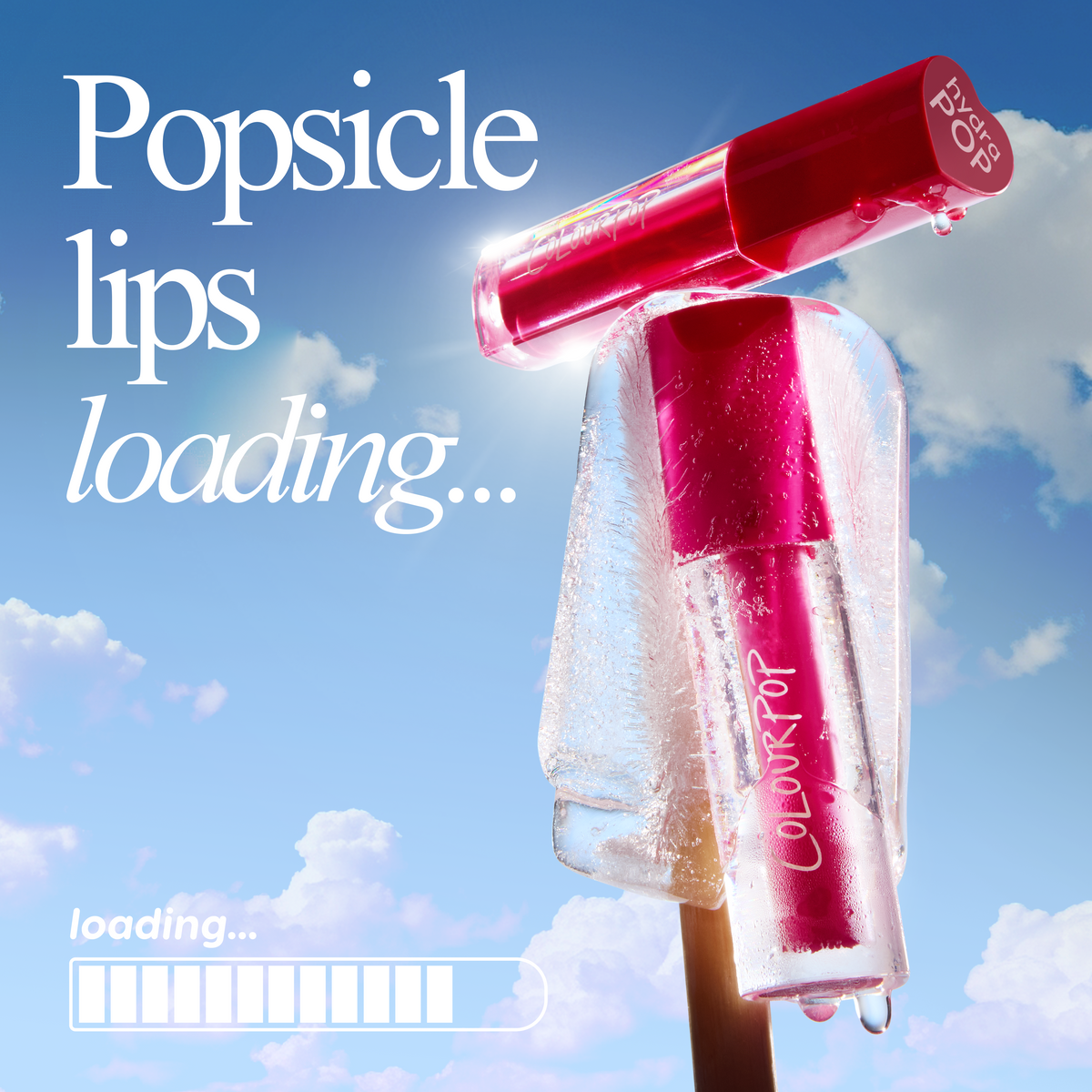 Tickle Me Pink ColourPop Lip Stain showcased inside a melting popsicle, droplets glistening as the hot-pink tube rests on a wooden stick against a sunny blue sky with clouds, suggesting a fresh, popsicle-lips, summer-ready look.