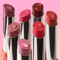 Hyper Shine Glossy Lipstick bullets in pinks, reds and berries, standing uncapped