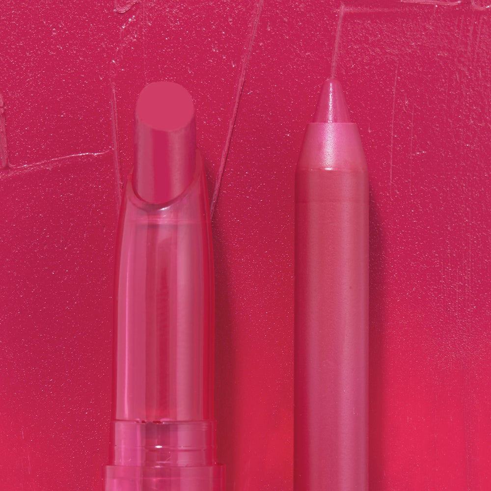 Ultimate Lip Combo, a ColourPop Lippie Stix + Pencil Set, showcases a hot-pink lipstick in a clear tube beside a matching lip pencil, displayed on a textured fuchsia swatch to highlight creamy, full-coverage color.