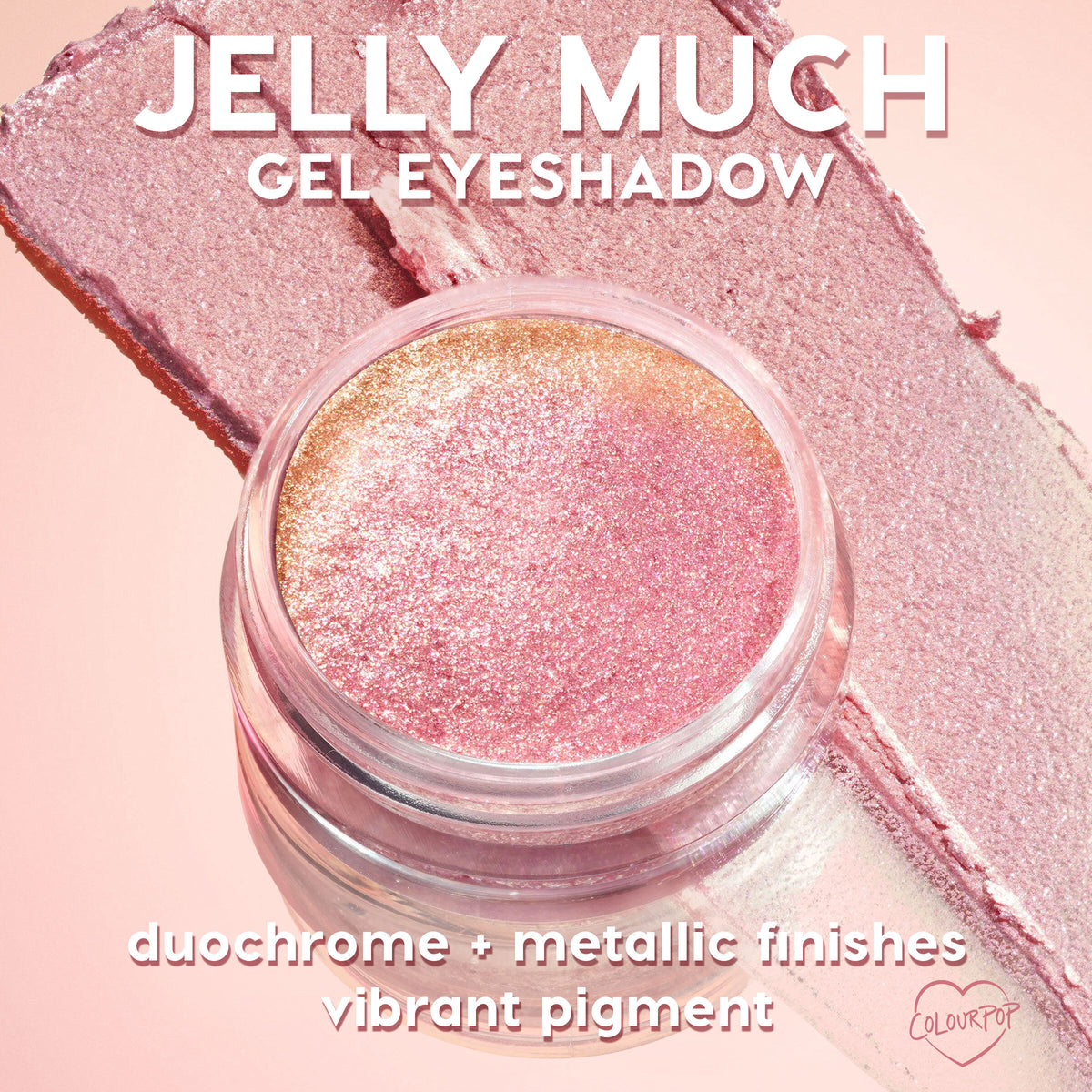 Open jar of ColourPop Jelly Much Shadow, Sage Bundle, showcasing shimmering pink-to-gold duochrome gel eyeshadow, set atop wide matching swatches on a pastel pink background to emphasize metallic finish and vibrant pigment.