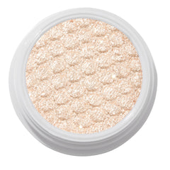 ColourPop Ladybird Super Shock Shadow glistening in a close-up, champagne beige ultra-glitter formula pressed with a scalloped cushion texture and packed in a round white pot, catching light for a high-shine metallic finish on a clean studio background.