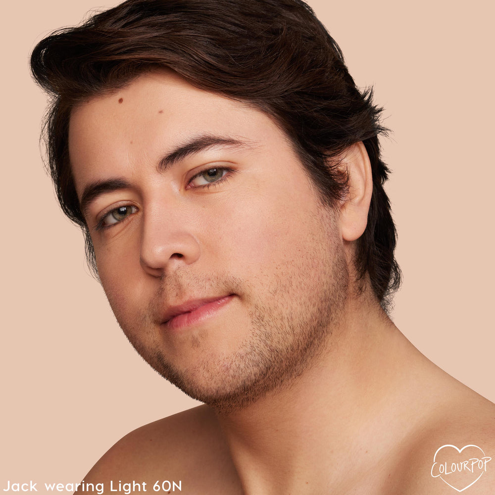 Light 60 N shade concealer smoothing a model’s under-eyes and complexion, showing natural medium coverage with a neutral undertone; close-up on a beige background, highlighting the creamy finish of ColourPop Pretty Fresh Creamy Concealer.