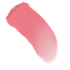 Coral pink swatch sweeping in a curved stroke on white, showcasing the creamy texture of the ColourPop Lip and Cheek Balm in Lucky U for lips and cheeks.